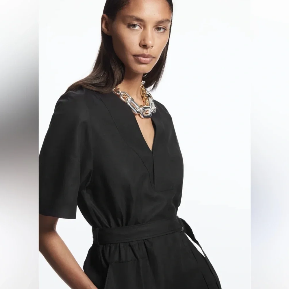 COS v neck belted playsuit 73% TENCEL Lyocell, 22% Linen, 5% Cotton.